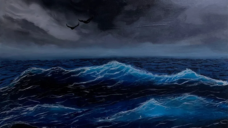 Dark storm clouds over a deep blue sea